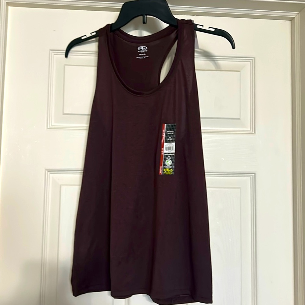 Size medium (8-10) racer back tank top. Moisture wicking materiall